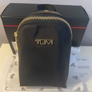 New in Box Tumi Charm pouch Black and Gold